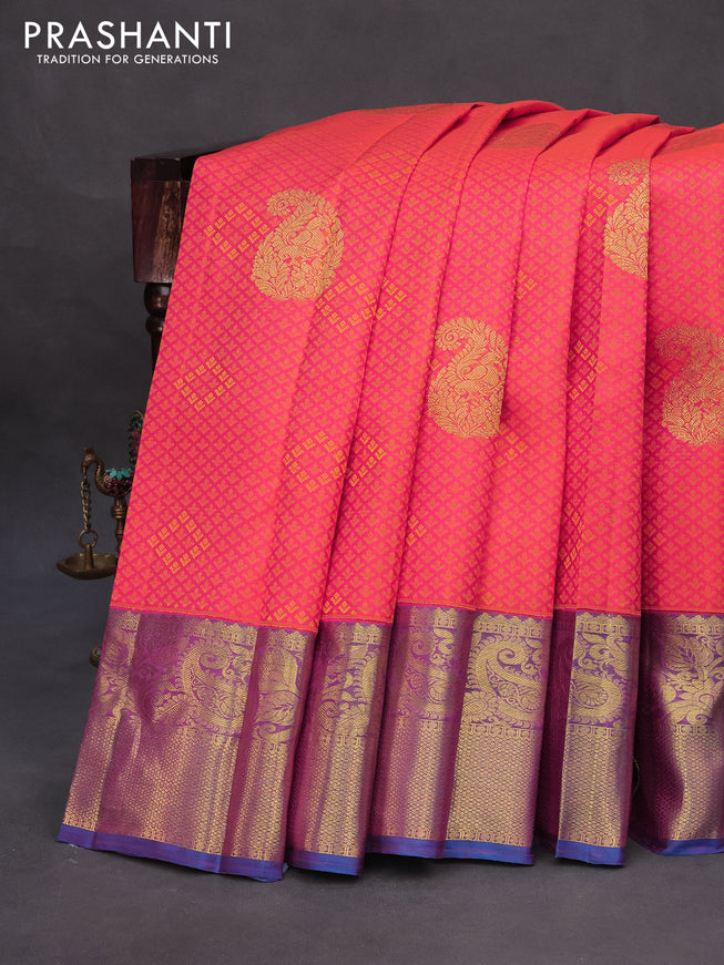 Pure kanchipuram silk saree dual shade of pinkish orange and cs blue with allover self emboss & zari buttas and zari woven border