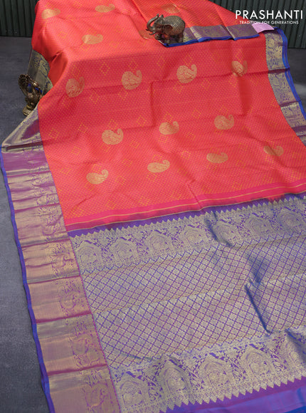 Pure kanchipuram silk saree dual shade of pinkish orange and cs blue with allover self emboss & zari buttas and zari woven border