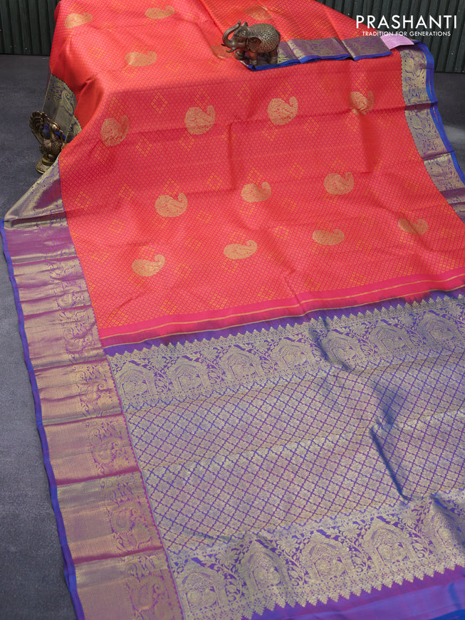 Pure kanchipuram silk saree dual shade of pinkish orange and cs blue with allover self emboss & zari buttas and zari woven border