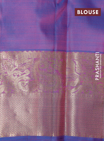 Pure kanchipuram silk saree dual shade of pinkish orange and cs blue with allover self emboss & zari buttas and zari woven border