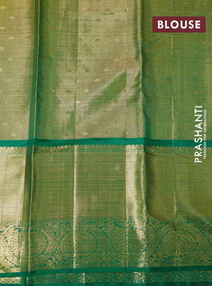 Pure kanchipuram tissue silk saree dual shade of pink and green with allover zari woven brocade weaves and long zari woven border