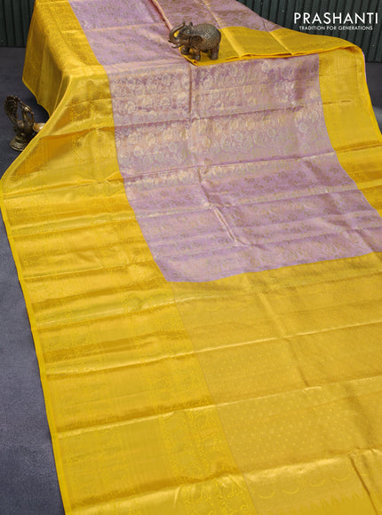 Pure kanchipuram tissue silk saree dual shade of lavender and yellow with allover zari woven brocade weaves and long zari woven border