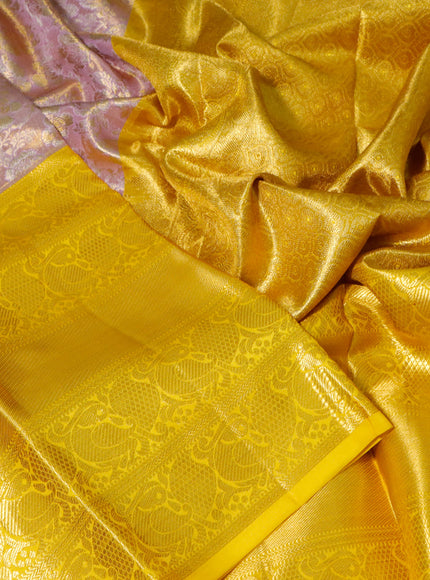 Pure kanchipuram tissue silk saree dual shade of lavender and yellow with allover zari woven brocade weaves and long zari woven border