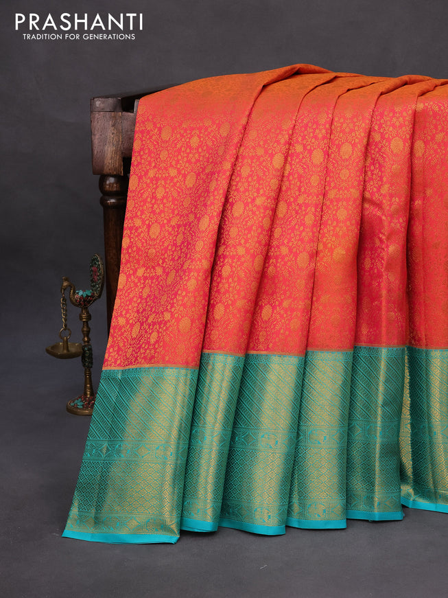 Pure kanchipuram silk saree dual shade of pinkish orange and teal green with allover zari woven brocade weaves and long zari woven border