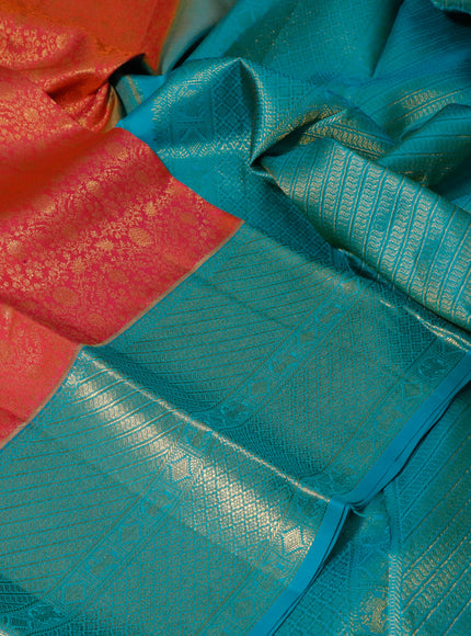 Pure kanchipuram silk saree dual shade of pinkish orange and teal green with allover zari woven brocade weaves and long zari woven border