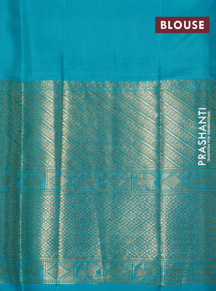 Pure kanchipuram silk saree dual shade of pinkish orange and teal green with allover zari woven brocade weaves and long zari woven border