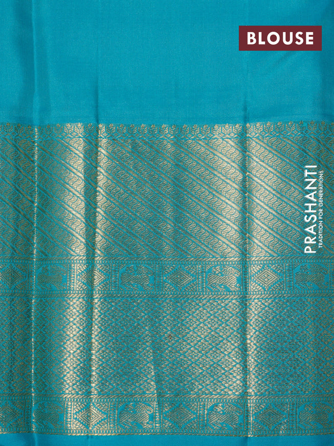 Pure kanchipuram silk saree dual shade of pinkish orange and teal green with allover zari woven brocade weaves and long zari woven border