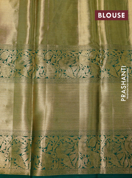 Pure kanchipuram tissue silk saree peach orange and green with allover zari woven brocade weaves and long zari woven border