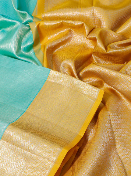 Pure kanchipuram silk saree teal green and yellow with allover silver zari woven brocade weaves and zari woven border