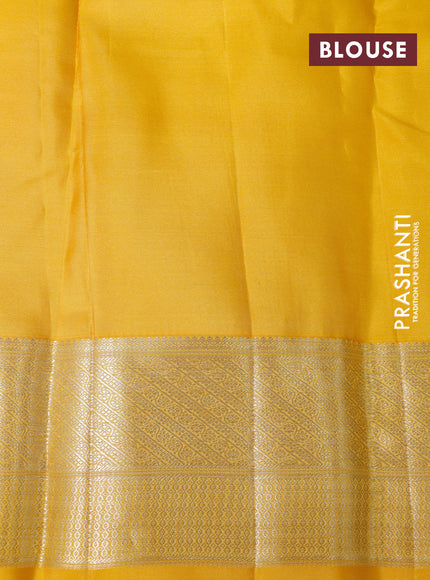 Pure kanchipuram silk saree teal green and yellow with allover silver zari woven brocade weaves and zari woven border