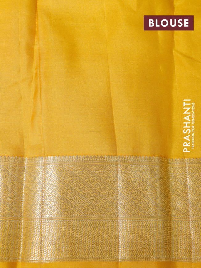 Pure kanchipuram silk saree teal green and yellow with allover silver zari woven brocade weaves and zari woven border