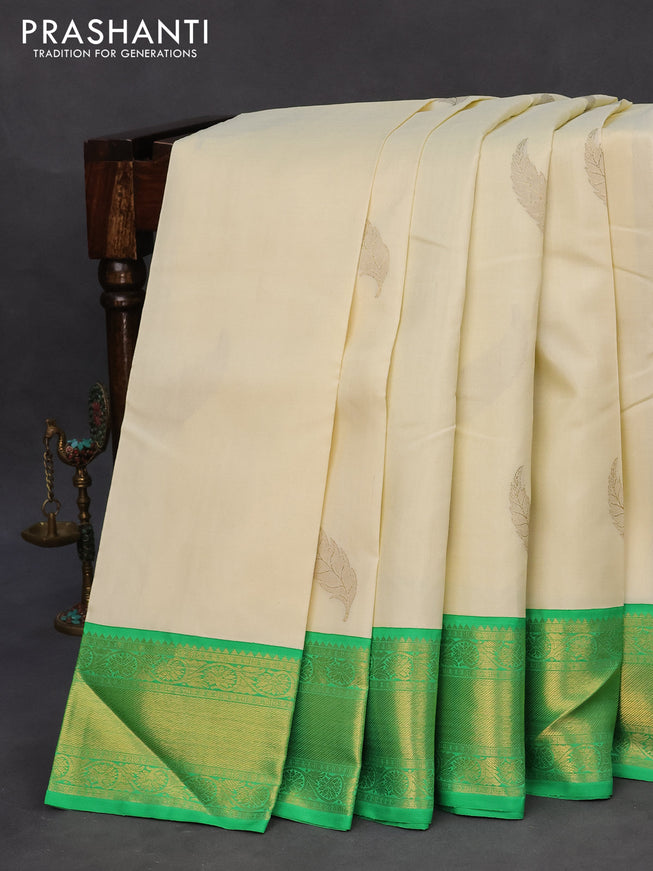 Pure kanchipuram silk saree off white and green with zari woven leaf buttas and zari woven border