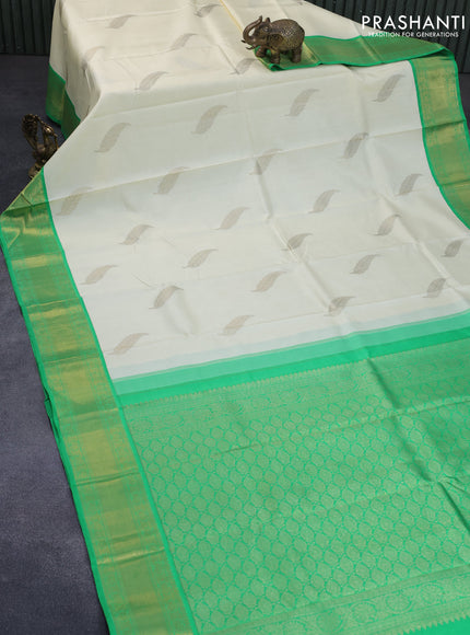 Pure kanchipuram silk saree off white and green with zari woven leaf buttas and zari woven border