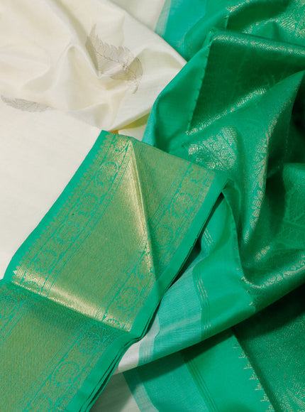 Pure kanchipuram silk saree off white and green with zari woven leaf buttas and zari woven border