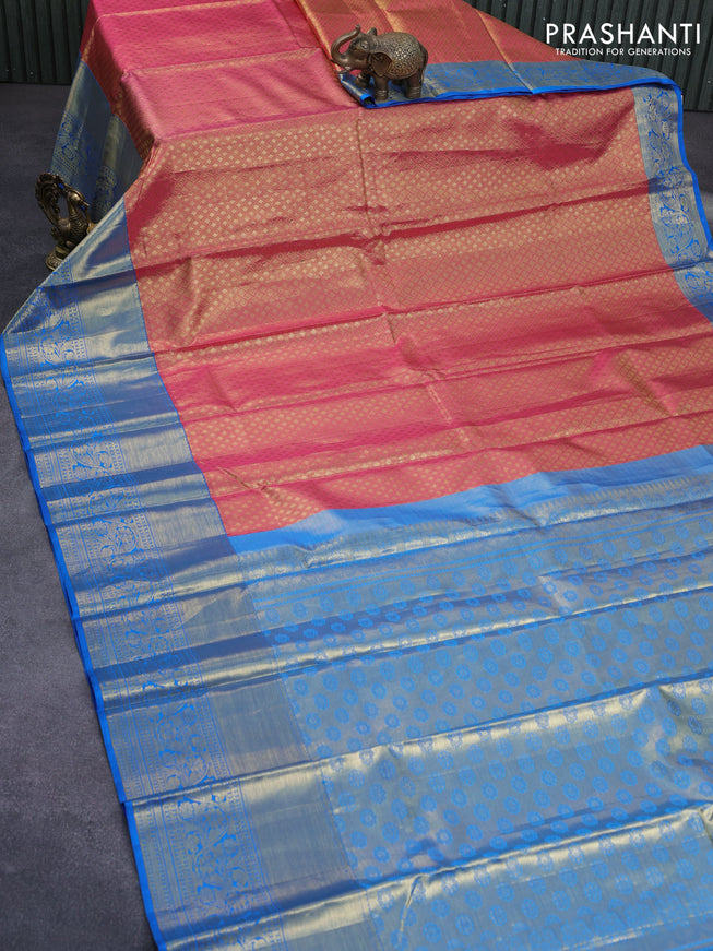 Pure kanchipuram tissue silk saree dual shade of pinkish gold and cs blue with allover zari woven brocade weaves and long zari woven border