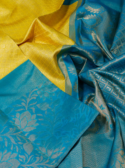 Pure kanchipuram silk saree yellow and teal blue with allover zari woven brocade weaves and long zari woven border