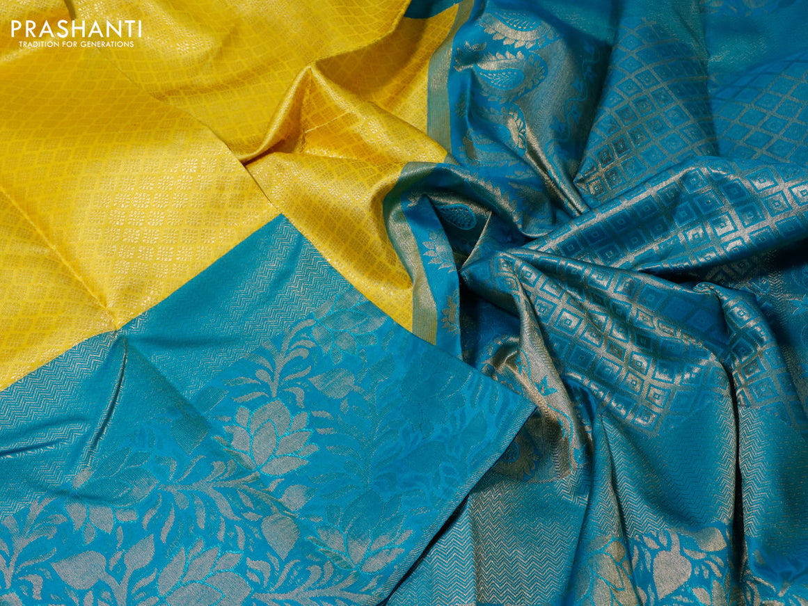 Pure kanchipuram silk saree yellow and teal blue with allover zari woven brocade weaves and long zari woven border