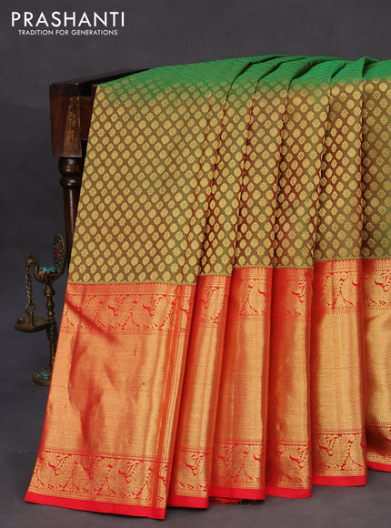 Pure kanchipuram silk saree dual shade of green and red with allover zari woven butta weaves and long zari woven border