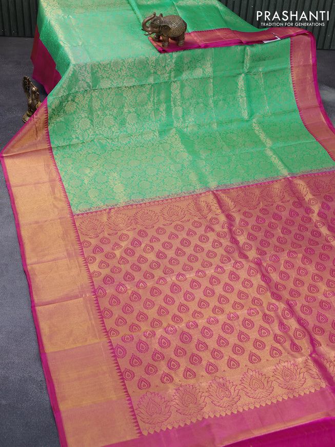 Pure kanchipuram silk saree teal green and pink with allover zari woven floral design brocade weaves and temple design zari border