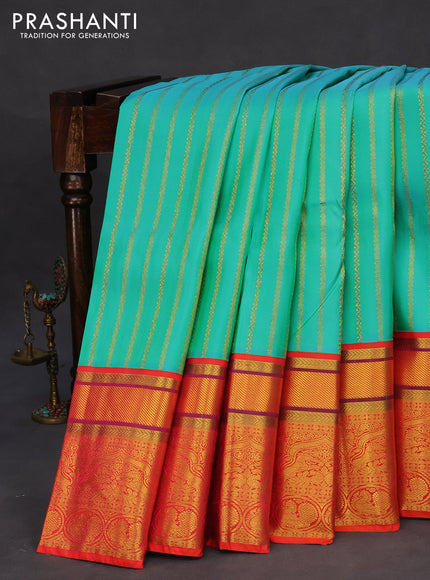 Pure kanchipuram tissue silk saree teal blue and dual shade of orange with allover zari weaves and zari woven border