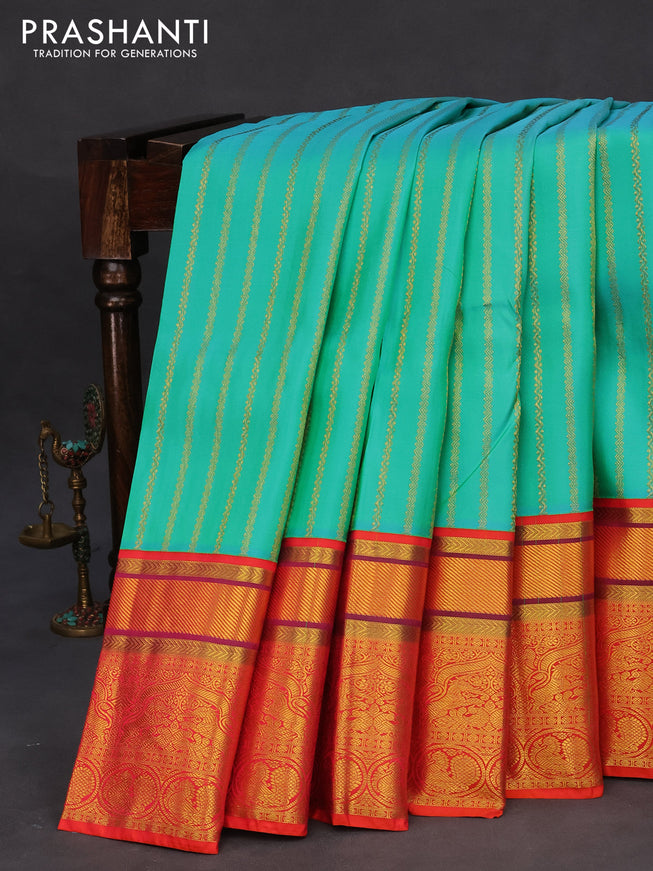 Pure kanchipuram tissue silk saree teal blue and dual shade of orange with allover zari weaves and zari woven border