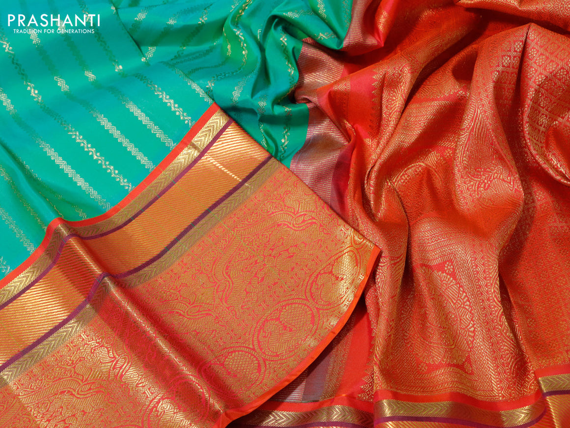 Pure kanchipuram tissue silk saree teal blue and dual shade of orange with allover zari weaves and zari woven border