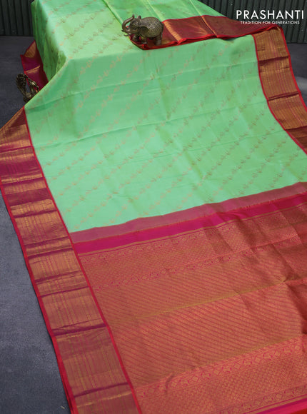 Pure kanchipuram silk saree light green and dual shade of pink with allover zari weaves and zari woven border