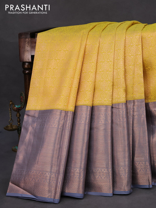 Pure kanchipuram silk saree yellow and grey with allover zari woven brocade weaves and zari woven border