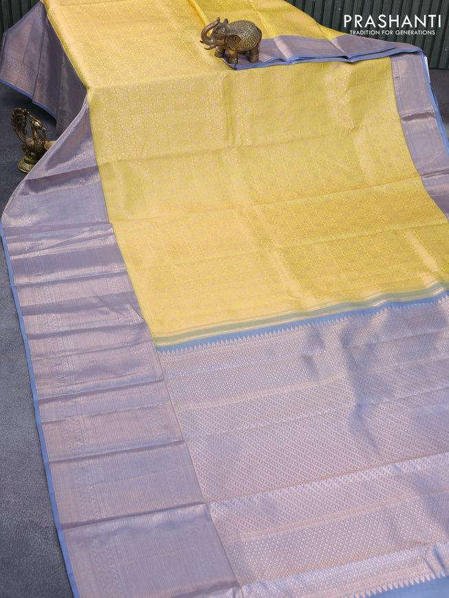 Pure kanchipuram silk saree yellow and grey with allover zari woven brocade weaves and zari woven border