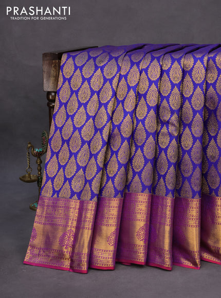 Pure kanchipuram silk saree blue and dual shade of purple with allover zari woven butta weaves and zari woven border