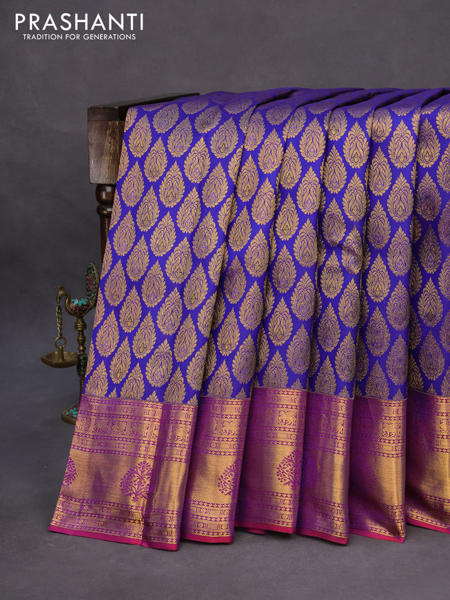 Pure kanchipuram silk saree blue and dual shade of purple with allover zari woven butta weaves and zari woven border