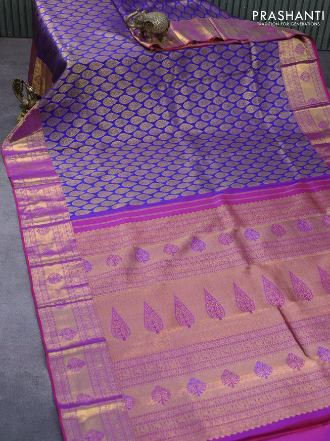 Pure kanchipuram silk saree blue and dual shade of purple with allover zari woven butta weaves and zari woven border