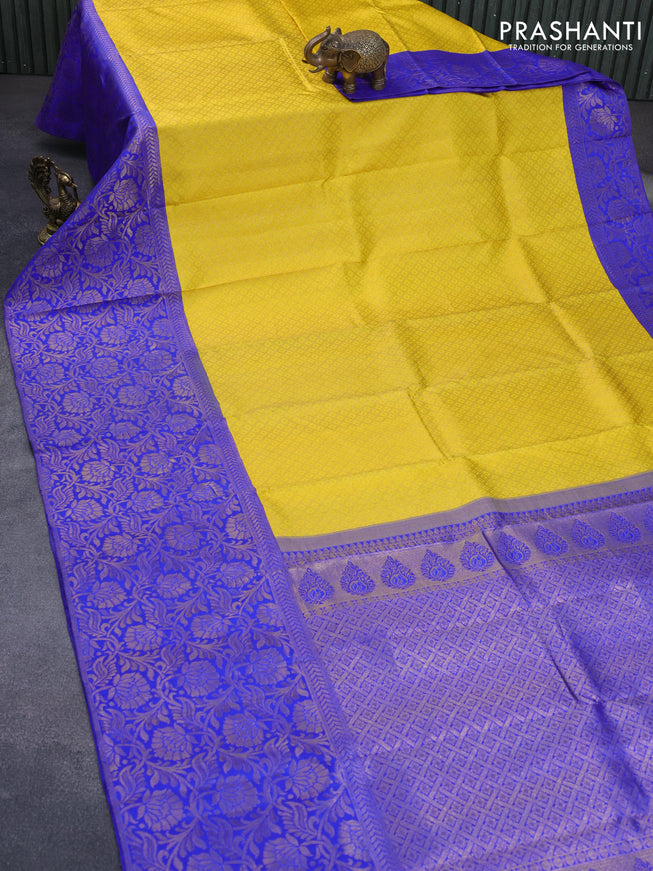 Pure kanchipuram silk saree yellow and royal blue with allover zari woven brocade weaves and long zari woven border