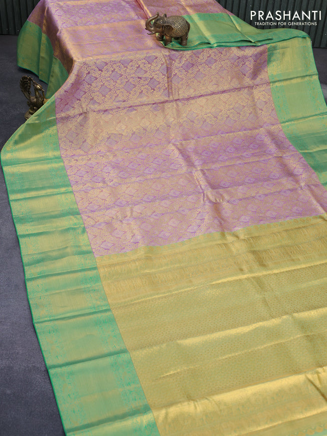 Pure kanchipuram tissue silk saree dual shade of lavender and teal green with allover zari woven brocade weaves and long zari woven border