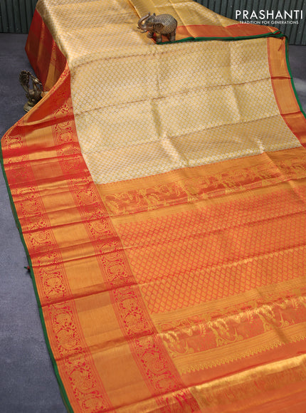 Pure kanchipuram tissue silk saree gold and red with allover zari woven brocade weaves and long annam zari woven border