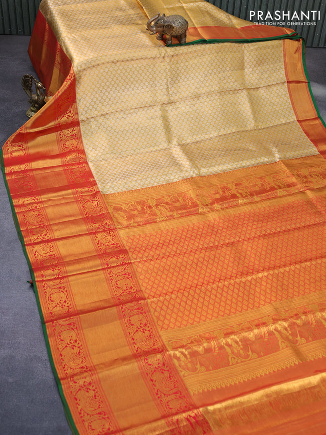 Pure kanchipuram tissue silk saree gold and red with allover zari woven brocade weaves and long annam zari woven border