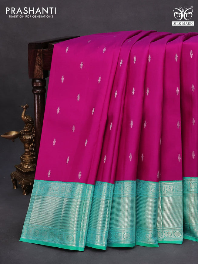 Pure kanchipuram silk saree magenta pink and dual shade of teal green with silver zari woven buttas and silver zari woven border