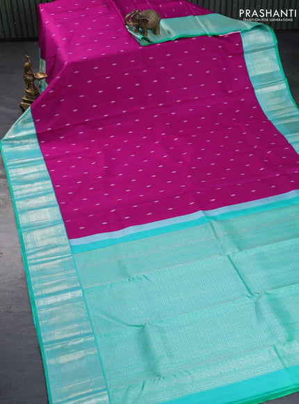 Pure kanchipuram silk saree magenta pink and dual shade of teal green with silver zari woven buttas and silver zari woven border