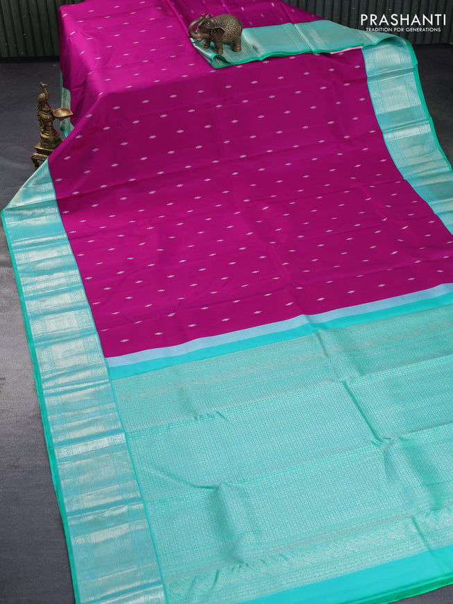 Pure kanchipuram silk saree magenta pink and dual shade of teal green with silver zari woven buttas and silver zari woven border