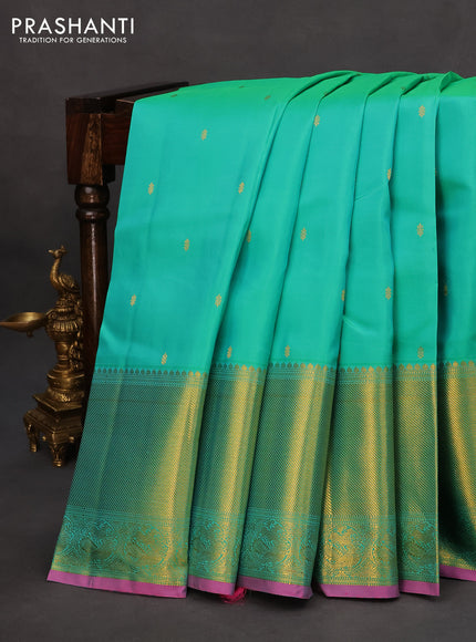 Pure kanchipuram silk saree dual shade of teal green and pink with zari woven buttas and long zari woven border