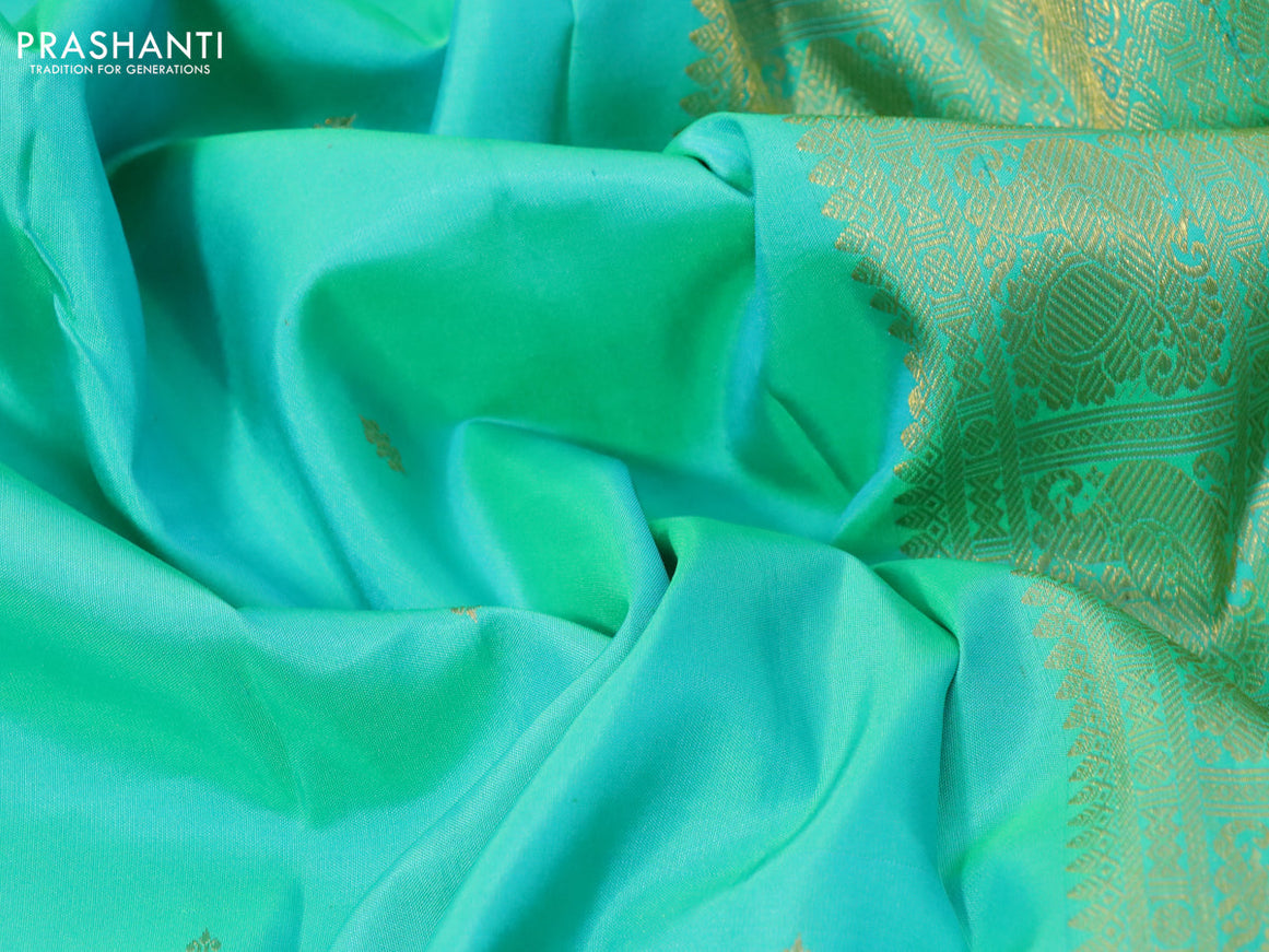 Pure kanchipuram silk saree dual shade of teal green and pink with zari woven buttas and long zari woven border