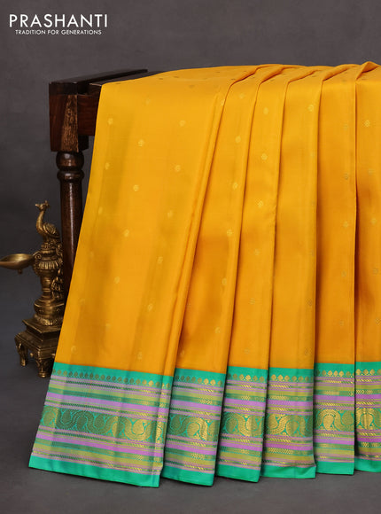 Pure kanchipuram silk saree yellow and teal green with zari woven buttas and rich zari woven border