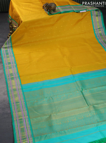 Pure kanchipuram silk saree yellow and teal green with zari woven buttas and rich zari woven border