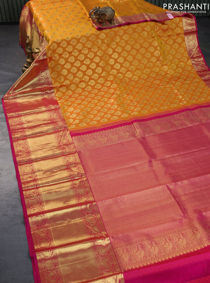 Pure kanchipuram silk saree dark mustard and pink with allover zari woven butta weaves and long rich zari woven border