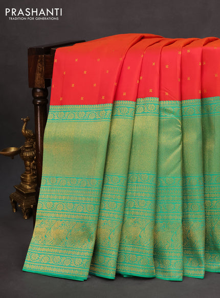 Pure kanchipuram silk saree dual shade of pinkish orange and dual shade of teal bluish green with zari woven buttas and long rich zari woven border