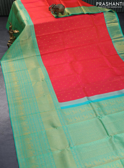 Pure kanchipuram silk saree dual shade of pinkish orange and dual shade of teal bluish green with zari woven buttas and long rich zari woven border