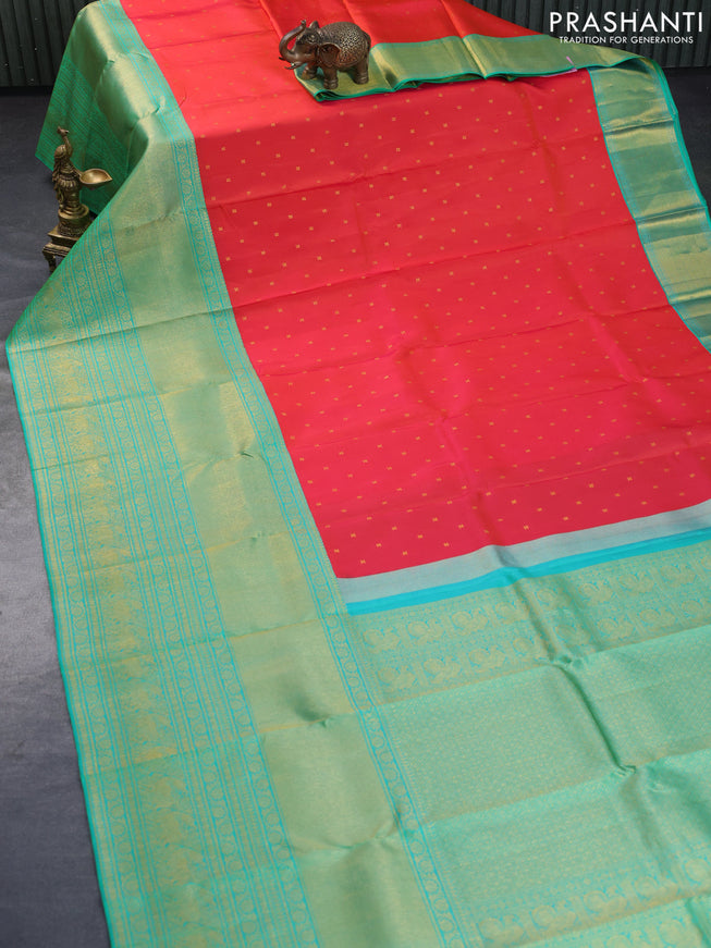 Pure kanchipuram silk saree dual shade of pinkish orange and dual shade of teal bluish green with zari woven buttas and long rich zari woven border