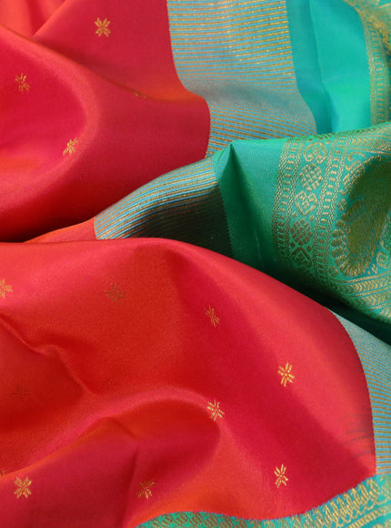 Pure kanchipuram silk saree dual shade of pinkish orange and dual shade of teal bluish green with zari woven buttas and long rich zari woven border