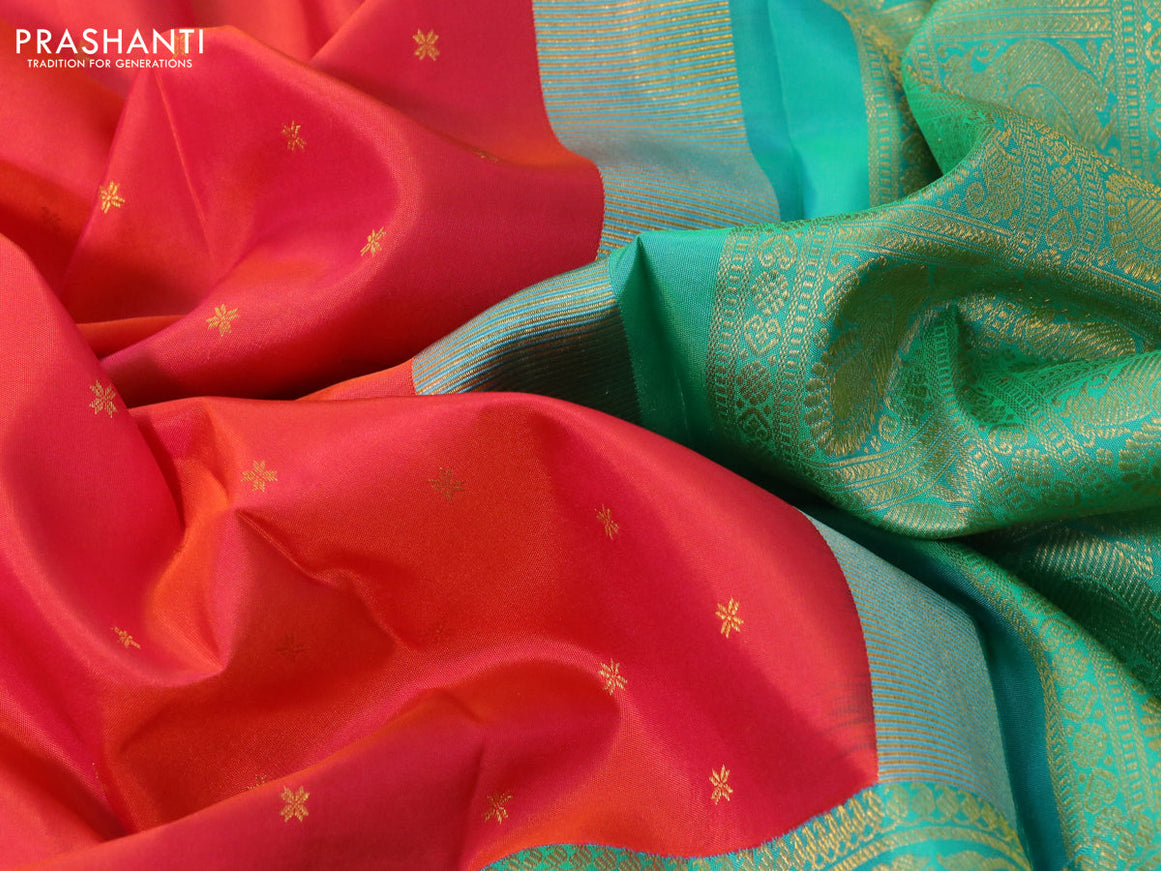 Pure kanchipuram silk saree dual shade of pinkish orange and dual shade of teal bluish green with zari woven buttas and long rich zari woven border