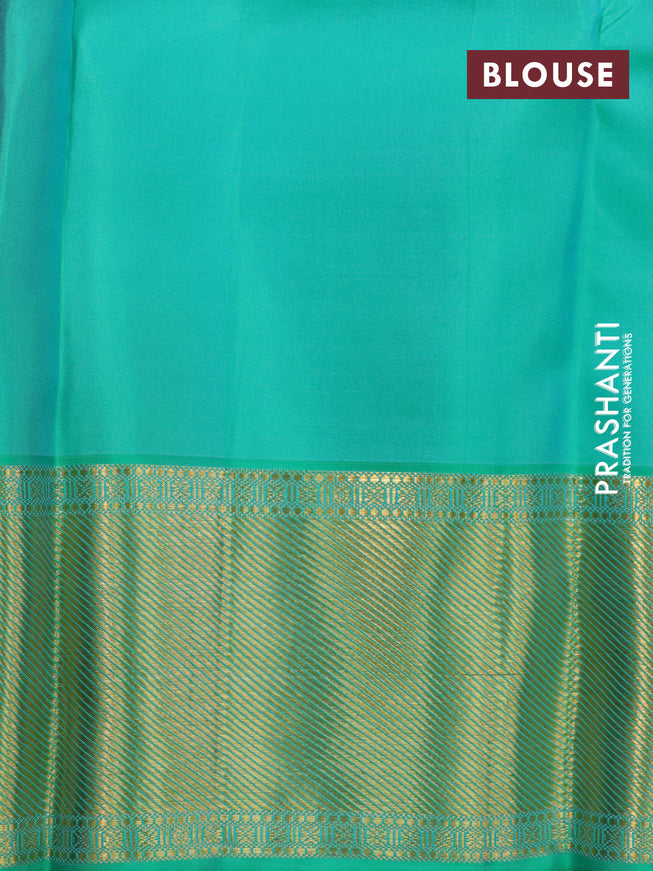 Pure kanchipuram silk saree dual shade of pinkish orange and dual shade of teal bluish green with zari woven buttas and long rich zari woven border